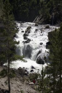 You can see a few people standing in the rocks at the bottom of the falls